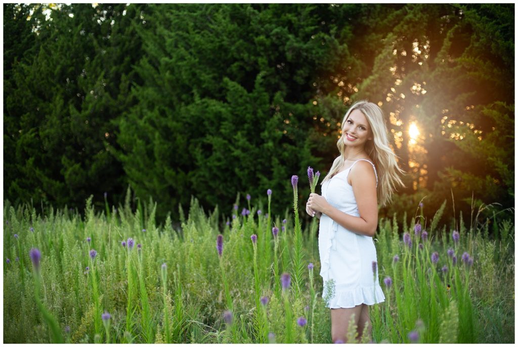 senior girl white dress purple flowers backlit Senior photographers Wichita, KS