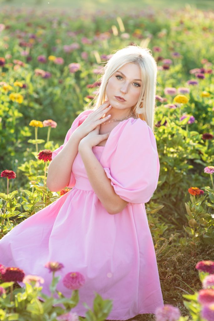 high school senior girl in field of zinnias pink dress Kim Stiffler Photography