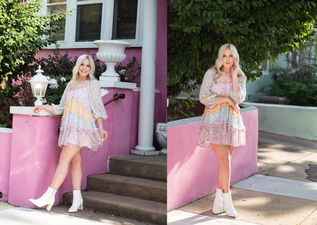 blonde girl in pastel dress in front of colorful housees