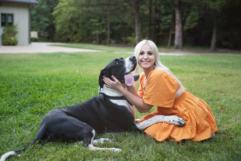 High School Senior Pictures girl in orange dress with her Great Dane