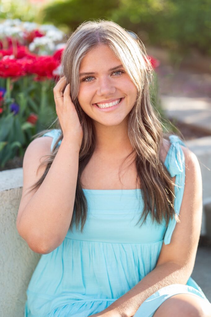 spring senior pictures in tulips white and blue dresses