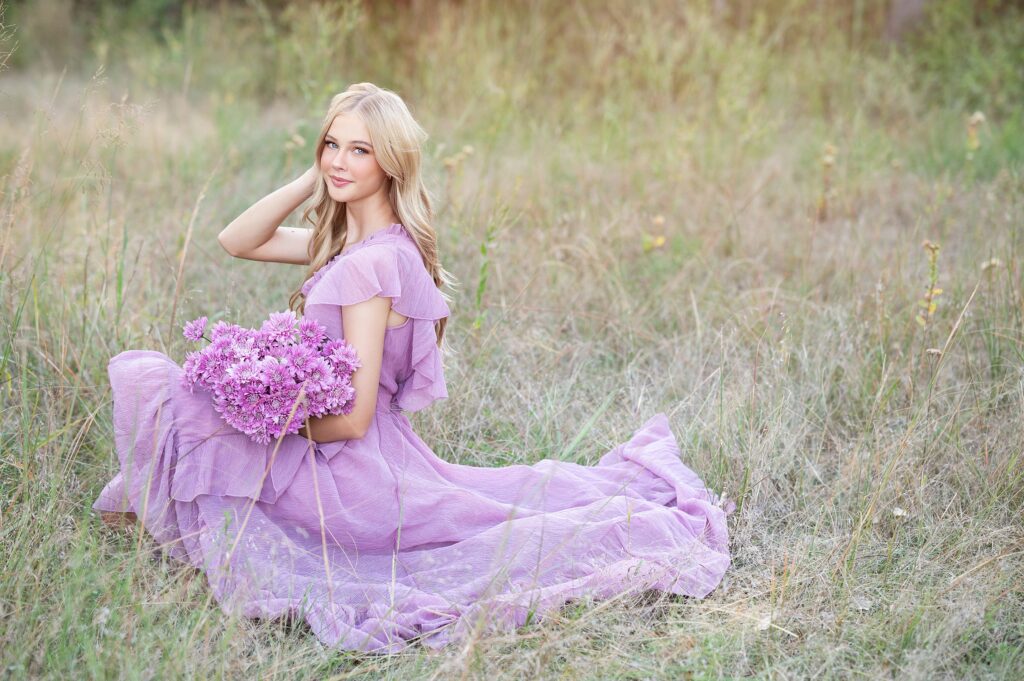 boho dreamy high school senior picture in field with lavender dress